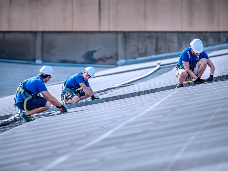 Metal roof being installed by roofers